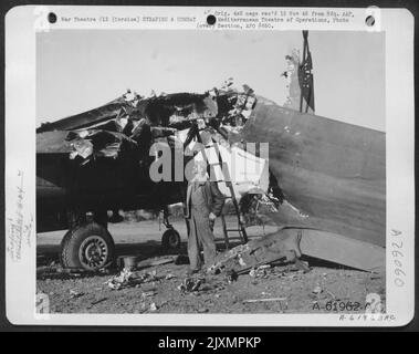 All that remains of a North American B-25 Mitchell of the 340th Bomb Group, after a Nazi aerial attack on an airfield at Corsica. 1944. Stock Photo