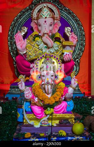 Beautiful idols of Lord Ganesha being worshipped at a mandal in Mumbai for the auspicious Indian festival of Ganesh Chaturthi Stock Photo