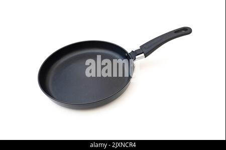 Empty black frying pan isolated on white Stock Photo