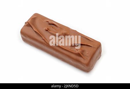Whole long milk chocolate bar isolated on white Stock Photo