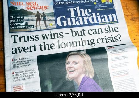 'Truss wins - but can she avert the looming crisis?' The Guardian newspaper headline front page Tory PM leadership race 6 September 2022 London UK Stock Photo