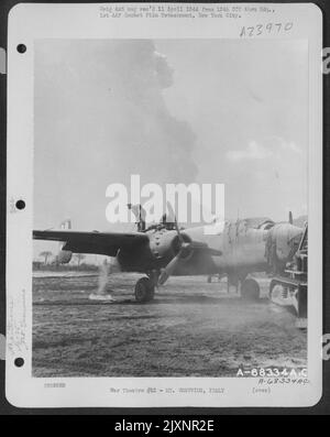 Crew Member Cleaning The Ashes And Cinders Off The Wing Of A North American B-25 Of The 340Th Bomb Group. This Was Caused By The Eruption Of Mt. Vesuvius On 23 March 1944. Stock Photo