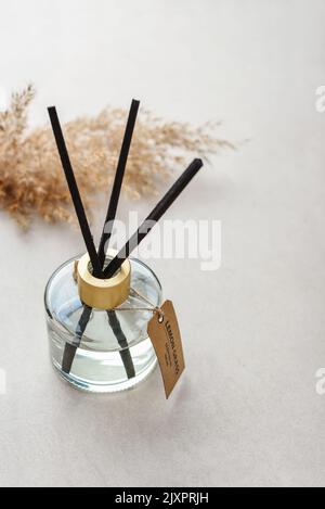 Fragrance diffuser for home on light concrete background close up Stock Photo