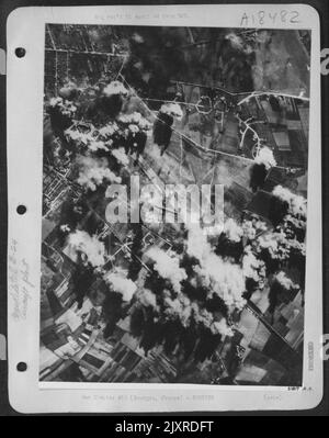 Bursts of bombs dropped from Consolidated B-24 Liberators of the US ...