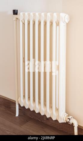 Old gas radiator in a house corridor Stock Photo - Alamy