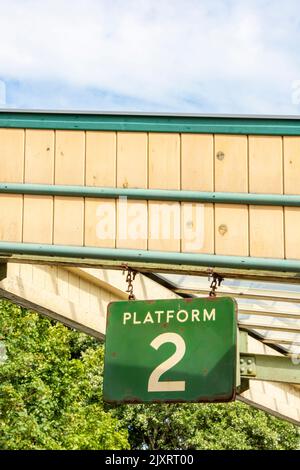 platform 2 sign hanging from a vintage platform canopy at the swanage railway in purbeck, dorset, uk Stock Photo