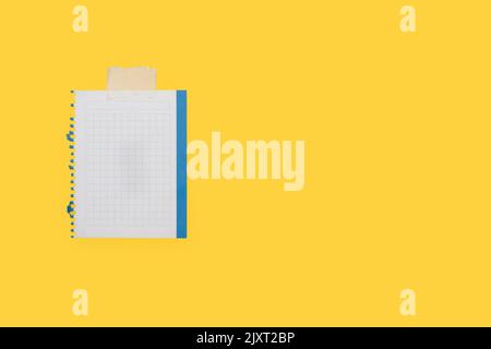A sheet of graph paper on a yellow background with copy space Stock Photo