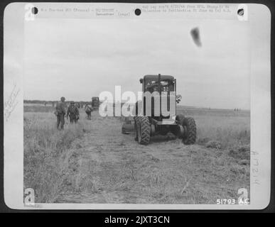One of the heavy graders which aviation engineers of the 9th Engineer Command used to build an emergency landing strip on the coast of France, completing a 3,600 ofot strip by 5:53 P.M. Thursday, 9 June 44. Detachments of this new 9th Air force Stock Photo