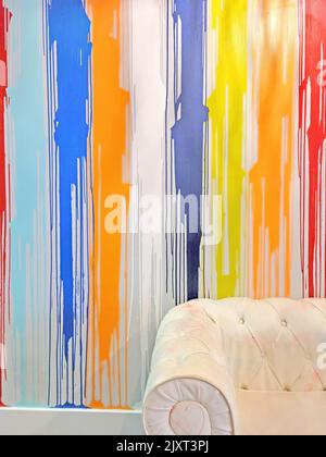 White stained leather chair with vertical striped paint streaks Stock Photo