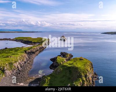 Aerial of the Rotten Island Lighthouse with Killybegs in background - County Donegal - Ireland. Stock Photo