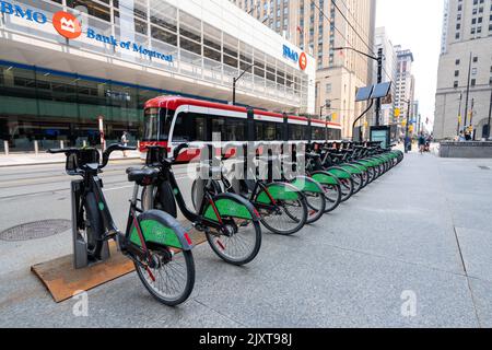 Bike Share Toronto bicycle-sharing system. King Street West streetcar station. Stock Photo