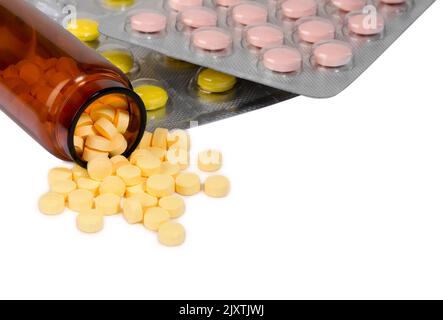 Packaging of pills and tablets isolated against a white background. Medicine. Tablets, blister capsules, glass bottles with medicine. Stock Photo