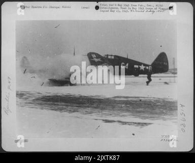 Europe - Skidding On Snowy Runway, This Republic P-47 Thunderbolt, After Landing, Crashed Into Parked Lane, Note Man Running From Accident. Stock Photo