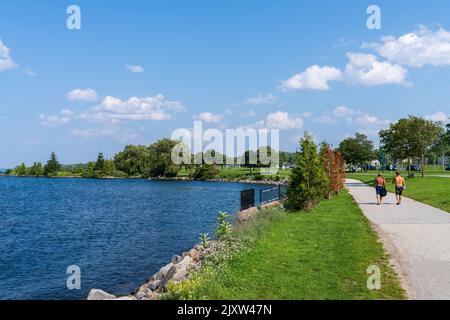 Barrie, Ontario, Canada - July 25 2021 : Walking Path on shore of Kempenfelt Bay, Lake Simcoe. Allandale Station Park in summer time. Stock Photo