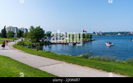 Barrie, Ontario, Canada - July 25 2021 : Walking Path on shore of Kempenfelt Bay, Lake Simcoe. Allandale Station Park in summer time. Stock Photo