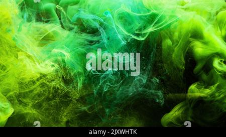 neon smoke colorful background ink green yellow Stock Photo