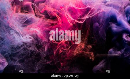 ink in water colorful background fume pink purple Stock Photo