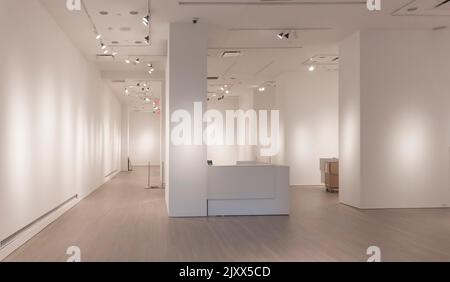 White walled empty room with lights and boxes Stock Photo