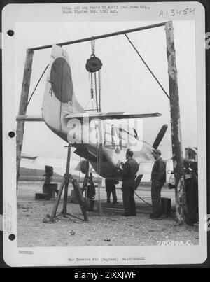 Maintenance Crew Makes Final Adjustments And Repairs To The North American P-51 'Mustang' Of The 383Rd Fighter Squadron, 364Th Fighter Group, 67Th Fighter Wing At 8Th Air Force Station F-375, Honnington, England. These Ground Men Work Long And Arduous Ho Stock Photo