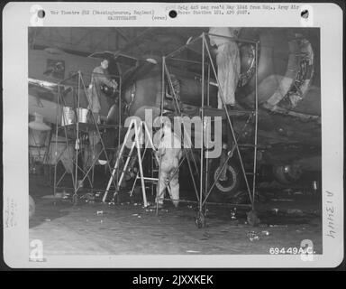 Mechanics Of The 322Nd Bomb Squadron, 91St Bomb Group, Overhaul A Boeing B-17 'Flying Fortress' At A Base In Bassingbourne, England. 2 October 1943. Stock Photo