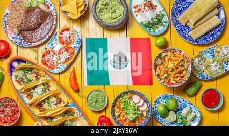 Mexican festive food for independence day independencia - around mexican flag. Top view , Yellow background Stock Photo