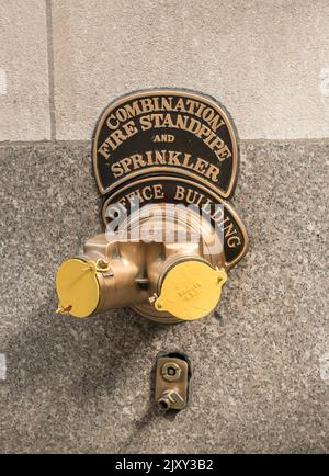 Combination Fire stand and sprinkler outside bulding in Nwe York, USA Stock Photo