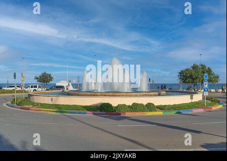 Fountain at the traffic circle on the promenade road in Blanes in Catalonia, Spain. Stock Photo