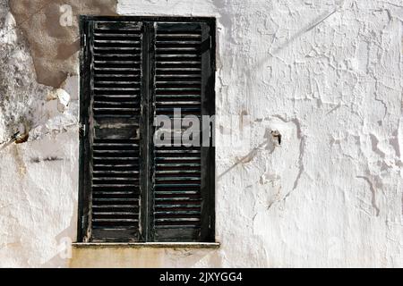 Urban abstract of building with shuttered window and wall with copy space on architecture Stock Photo