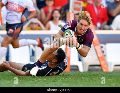 Tate McDermott of the Reds dives over to score a try during the Round 6 ...