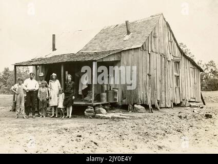 Poor Family about 1930, The Great Depression, Ramshackle House, Shack, Washboard, Depression Era Family, Home, Classic 1930s Family Stock Photo