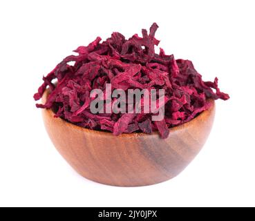 Dry beetroot in wooden bowl, isolated on the white background. Chopped dried beet. Stock Photo