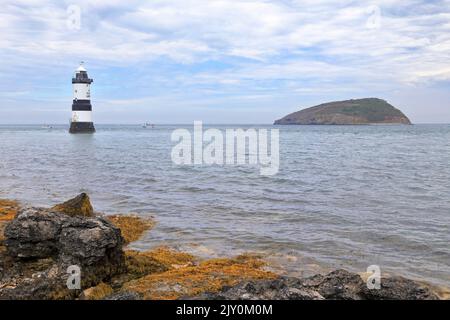 Penmon Lighthouse or Trwyn Du Lighthouse and Puffin Island, Penmon, Isle of Anglesey, Ynys Mon, North Wales, UK. Stock Photo