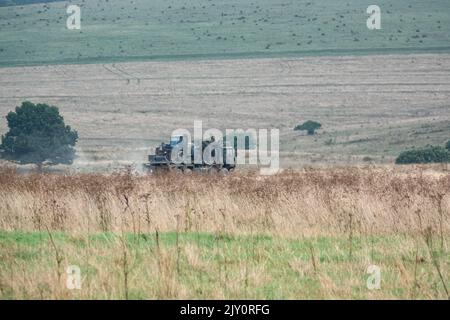 British army MAN HX77 SV 8x8 EPLS Heavy Utility Truck in action on a military exercise Stock Photo