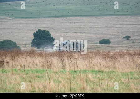 British army MAN HX77 SV 8x8 EPLS Heavy Utility Truck in action on a military exercise Stock Photo