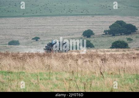 British army MAN HX77 SV 8x8 EPLS Heavy Utility Truck in action on a military exercise Stock Photo