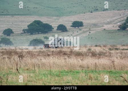 British army MAN HX77 SV 8x8 EPLS Heavy Utility Truck in action on a military exercise Stock Photo