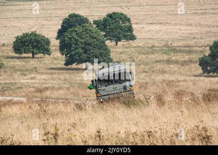 British army MAN HX58 6x6 Heavy Utility Truck EPLS in action on a military exercise Stock Photo