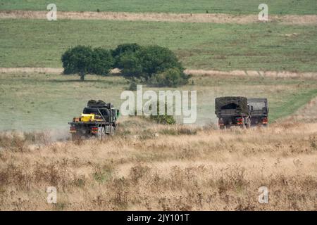 British army MAN HX58 6x6 Heavy Utility Truck EPLS in action on a military exercise Stock Photo