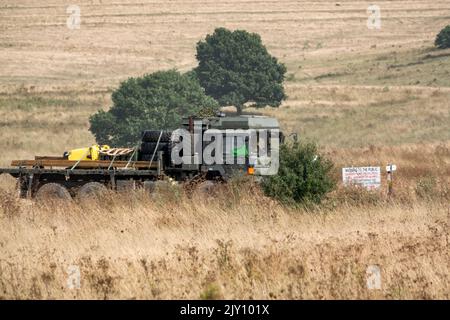 British army MAN HX58 6x6 Heavy Utility Truck EPLS in action on a military exercise Stock Photo