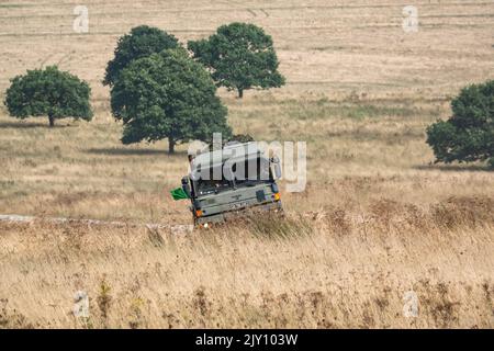 British army MAN HX58 6x6 Heavy Utility Truck EPLS in action on a military exercise Stock Photo