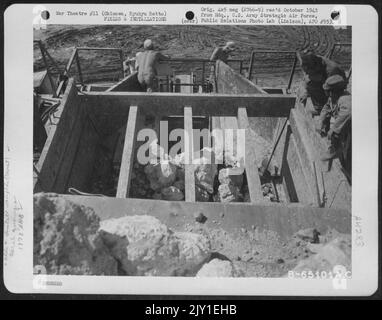 A Stone Quarry On Okinawa, Ryukyu Retto, Is Operated By Men Of The 1878Th Engineer Aviation Battalion. Stock Photo