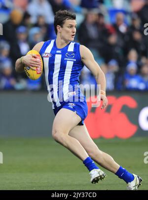 Scott Thompson of the Kangaroos runs during the Round 16 AFL match