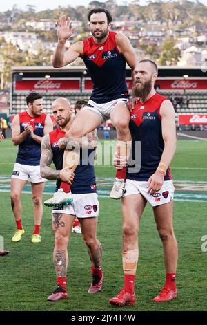 Retiree Jordan Lewis of the Demons gets carried off by Nathan