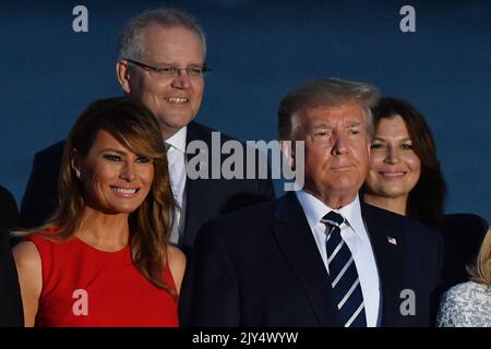 U.S. President Donald Trump, wife Melania and Australia's Prime Minister Scott Morrison with wife Jenny at the family photograph during the G7 Summit in the town of Biarritz, 800km south of Paris in France, Sunday, August 25, 2019. (AAP Image/Mick Tsikas) NO ARCHIVING ** STRICTLY EDITORIAL USE ONLY **