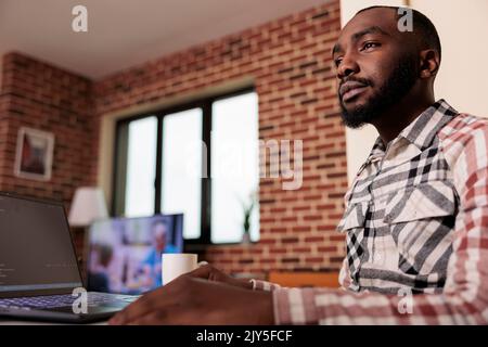 Programmer writing program code and html data base on new user interface. Male freelancer using terminal window and developing online app cloud server, learning coding language. Stock Photo