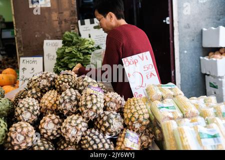 Pineapples and corn for sale at a Vietnamese grocer in Cabramatta — Sydney, Australia Stock Photo