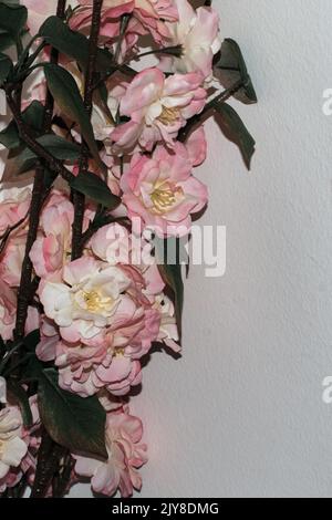 Artificial pink and yellow flowers Stock Photo