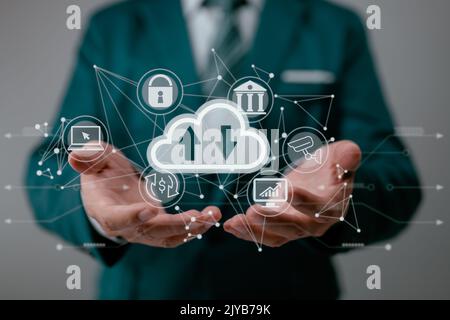 A guy holding displaying a cloud computing schematic. Cloud computing networking and internet service principles for data storage. Stock Photo