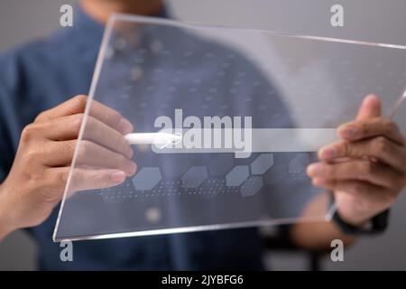 Search Engine Optimization using Data Search Technology. A man's use tablet searching for information. Using Search Console to help you with your webs Stock Photo