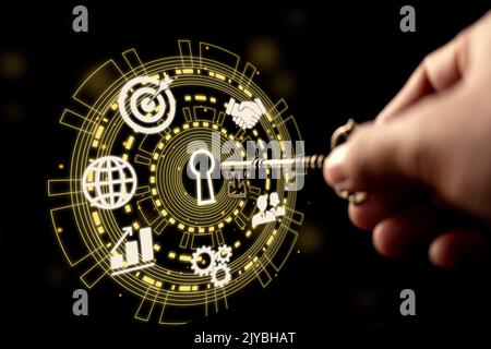 Key in hand. Business, teamwork, aim, and growth symbols on a Key Performance Indicator (KPI). The secret to success. Stock Photo